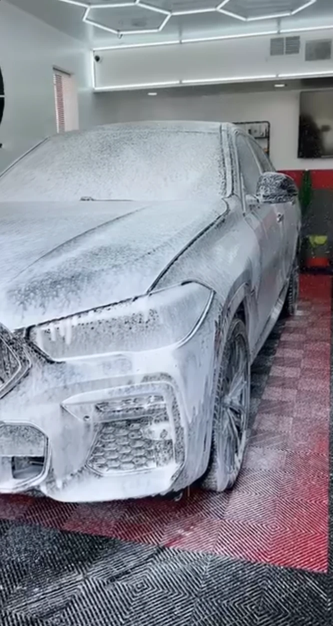 BMW covered in cleaning foam during an exterior car wash at Vanish Auto Tints in Van Nuys