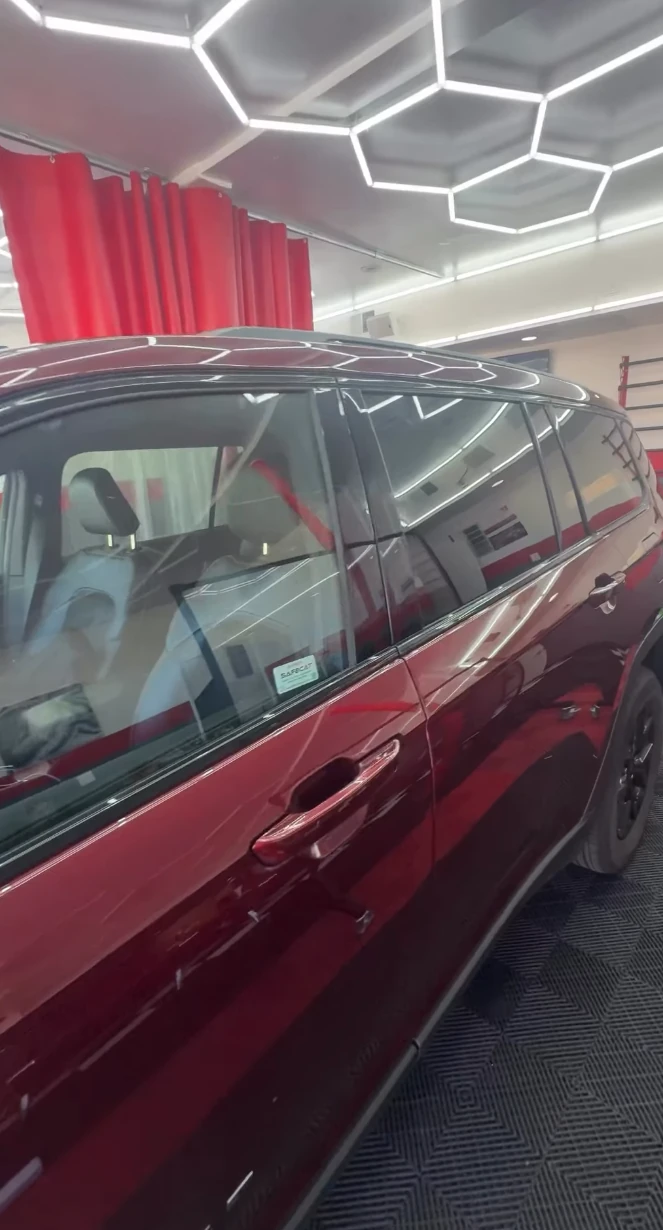 Red SUV before ceramic window tint at Vanish Auto Tints in Van Nuys