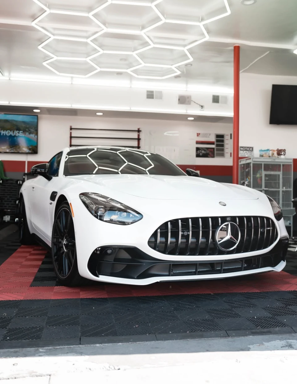 White Mercedes-AMG at Vanish Auto Tints in Van Nuys, shown with an illustrative tint shade overlay